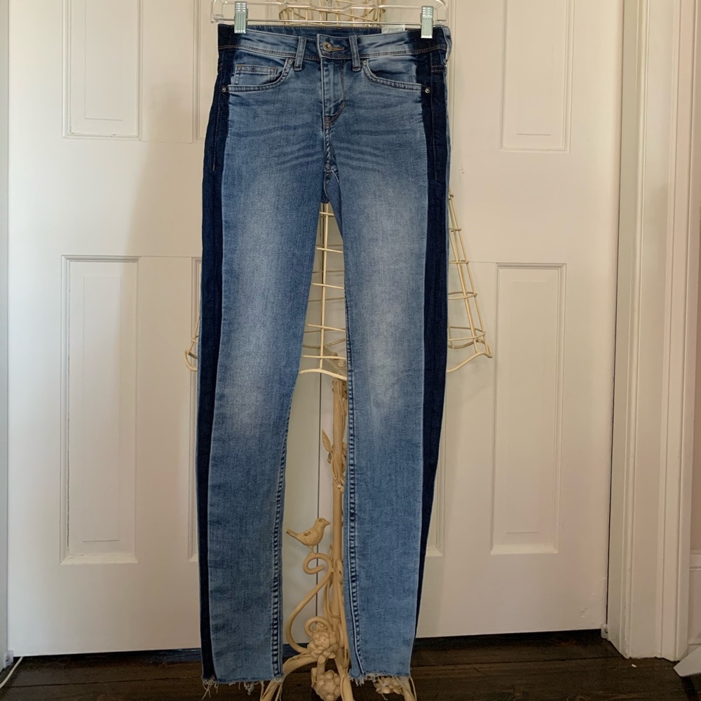 Jeans with dark denim stripe down side. Size: 2